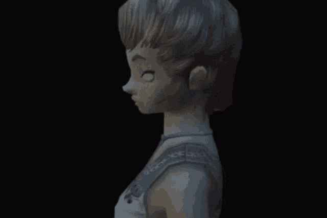 a statue of a woman with white eyes and a blue necklace