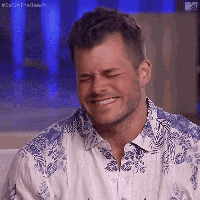 a man wearing a hawaiian shirt is laughing with the hashtag #exonthebeach