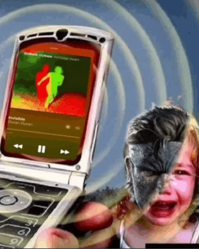 a child is crying in front of a flip phone that says invisible
