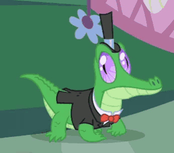 a crocodile wearing a top hat and bow tie