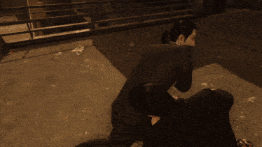a person is laying on the ground with purple smoke coming out of their mouth