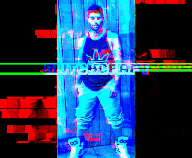 a man standing in front of a wooden wall with the word glitch visible