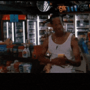 a man in a white tank top is standing in a store with a sign that says 666 on it