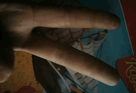 a close up of a person 's hand with their fingers crossed
