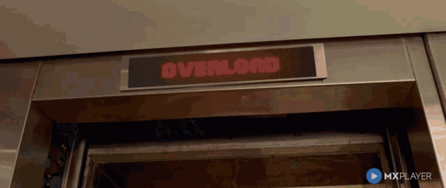 an elevator with a sign that says " overload " on it