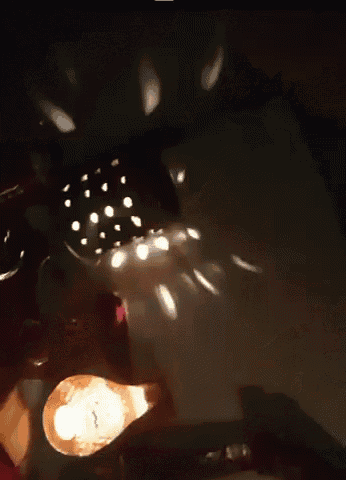 a blurred image of a person 's face with a light behind them