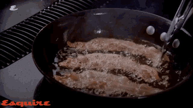 bacon is being cooked in a frying pan with the word esquire on the bottom