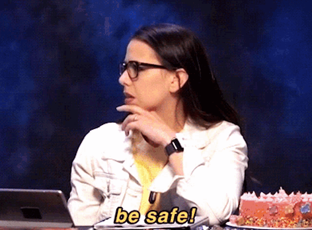 a woman wearing glasses and a watch says " be safe "