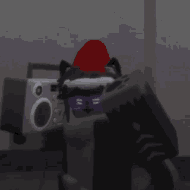a raccoon wearing sunglasses and a red hat is standing in front of a radio