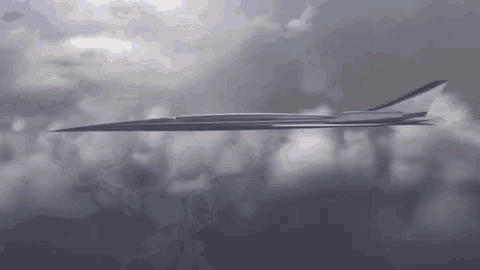 a supersonic jet is flying through a cloudy sky .