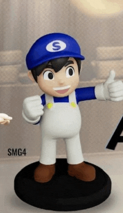 a statue of a boy wearing a blue hat and overalls giving a thumbs up .