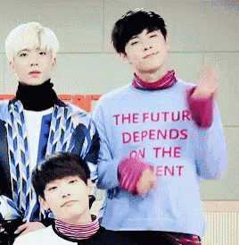 a man wearing a blue sweater that says the future depends on the ment