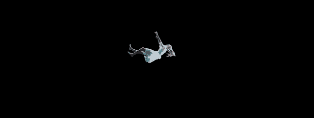 a woman in a white dress is falling into the dark .