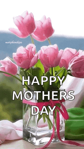 a vase of pink flowers with the words `` happy mothers day '' written on it .