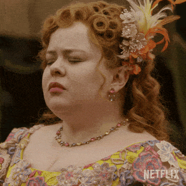 a close up of a woman 's face with a netflix logo on the bottom