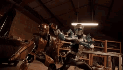 a couple of superheros are fighting in a room