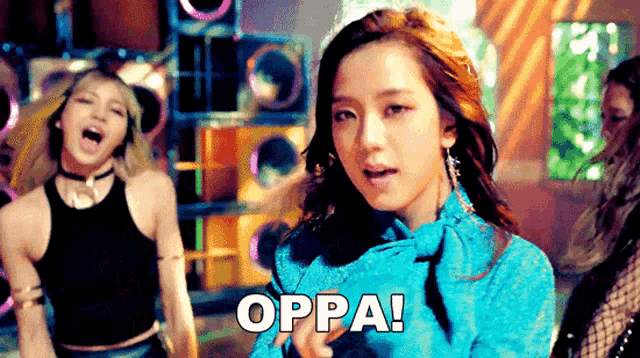 a woman in a blue top says oppa on the screen