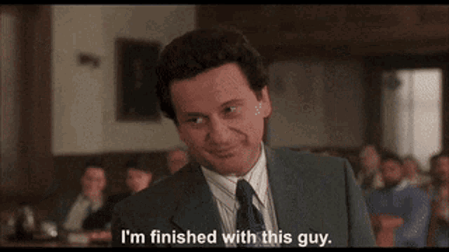 a man in a suit and tie is smiling and saying i 'm finished with this guy