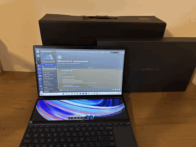 an asus zenbook laptop is open to a discord channel