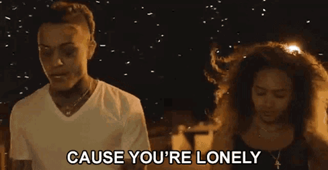 a man and a woman are standing next to each other and the man is saying `` cause you 're lonely ''