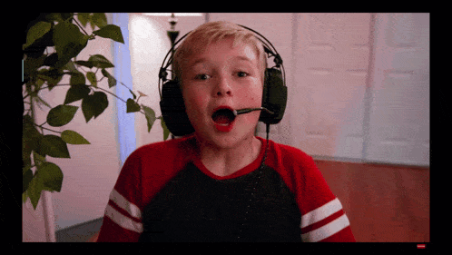 a boy wearing headphones with a microphone on his head