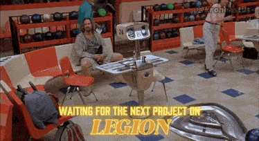 a man sits at a table in a bowling alley with the words " waiting for the next project on legion "