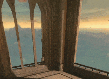 a room with a view of a body of water and mountains