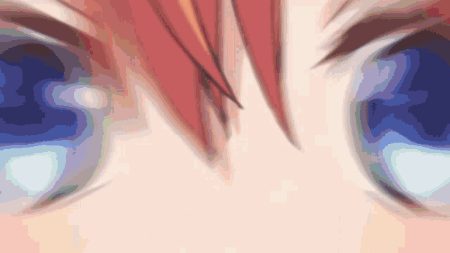 a close up of a person 's eyes with a blurred background