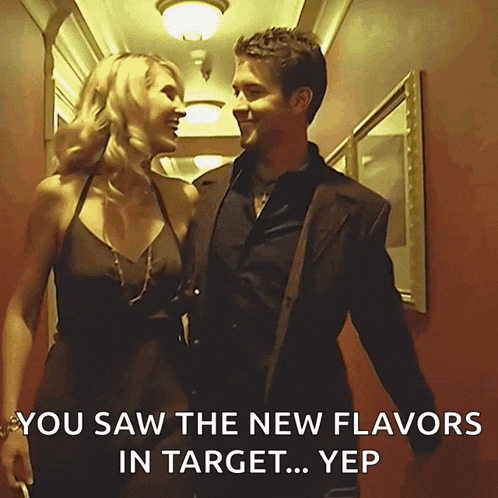 a man and a woman are walking down a hallway with a caption that says you saw the new flavors in target yep