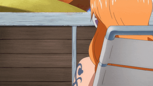 a woman with a tattoo on her arm that says ' nami '