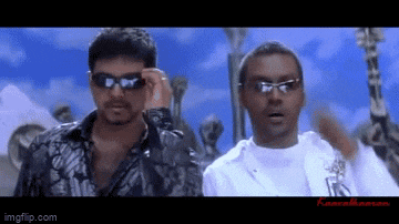 two men wearing sunglasses are standing next to each other