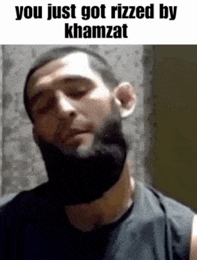 a man with a beard is making a funny face and says `` you just got rizzed by khamzat '' .
