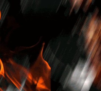 a man stands in front of a fire with the word atm written on it