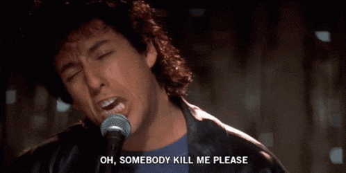 a man singing into a microphone with the words " oh somebody kill me please " above him