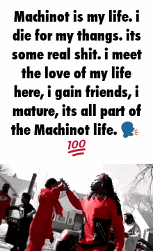 a man in a red jumpsuit is dancing with another man in a red jumpsuit in front of a group of men .