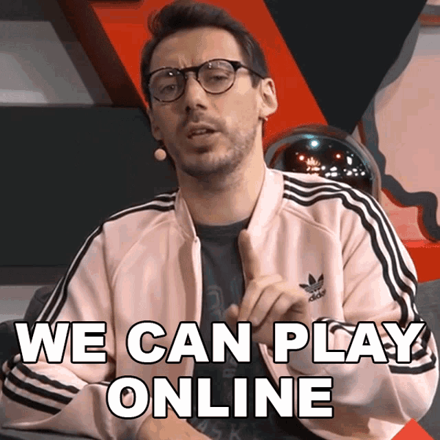 a man with glasses and a pink adidas jacket says we can play online