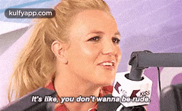 a woman is talking into a microphone and saying `` it 's like you don 't wanna be rude ''