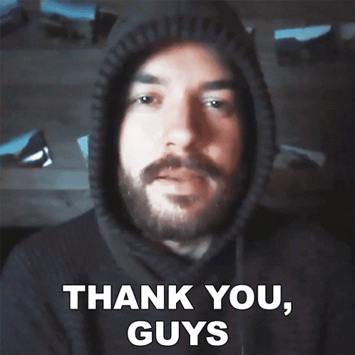 a man with a beard is wearing a hoodie and says thank you guys