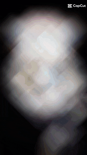 a blurred image of a person 's face with a caption that says capcut