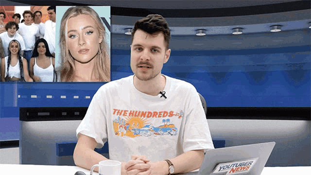 a man wearing a white shirt that says " the hundreds "