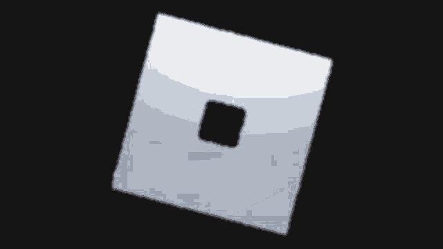 a white square with a black square in the middle on a black background .