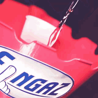 water is being poured into a container that says energizer on it