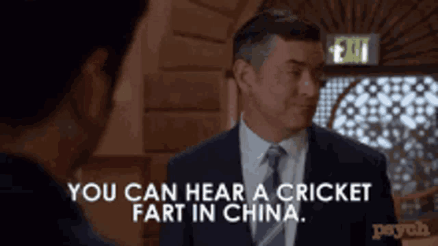 a man in a suit and tie is saying you can hear a cricket fart in china .