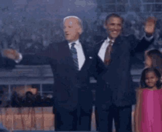 a man in a suit and tie is dancing in front of a crowd and says `` you ain t black ! ''