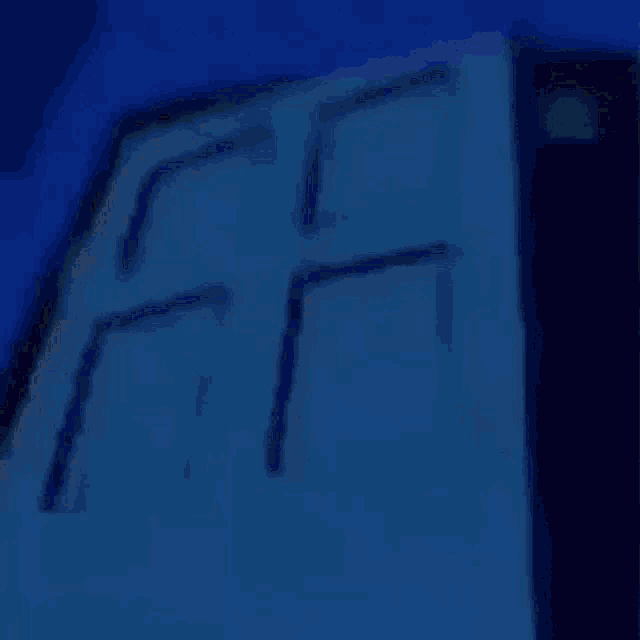 homer simpson is standing in a dark room with the words quien pingueo written above him .