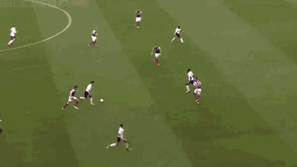 a soccer game is being played on a field with sky bet banners