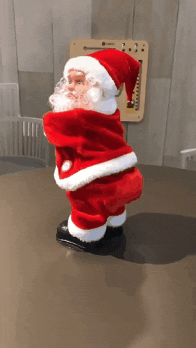 a statue of santa claus is on a table