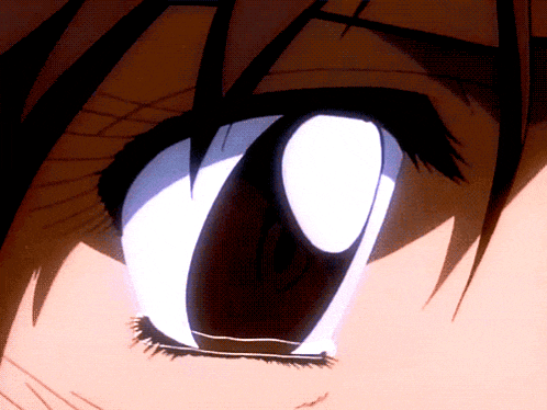 a close up of a person 's eye with a glowing white pupil