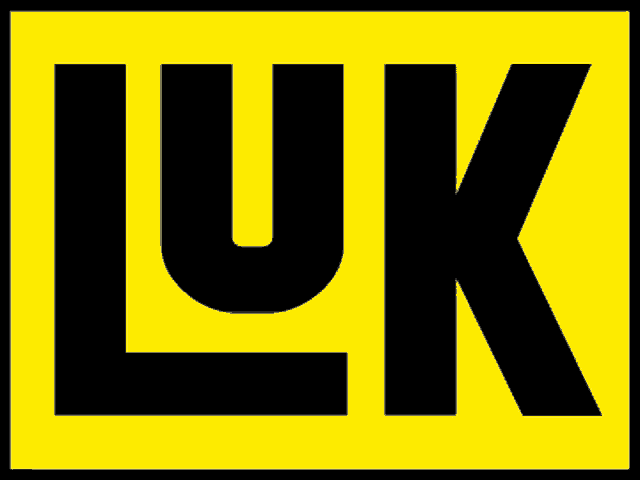 a yellow sign with the letter uk in black