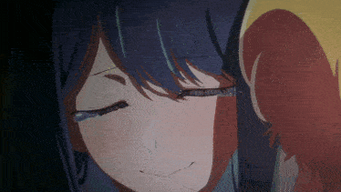 a close up of a girl 's face with tears coming out of her eyes